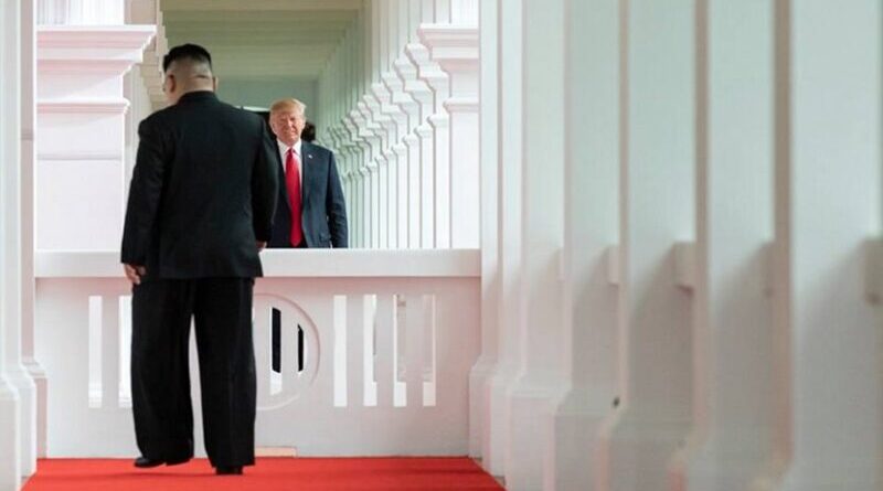 President Donald J. Trump watches as North Korean leader Kim Jong Un, walks toward him for their first-ever meeting, Tuesday, June 12, 2018, at the Capella Hotel in Singapore. (Official White House Photo by Stephanie Chasez)