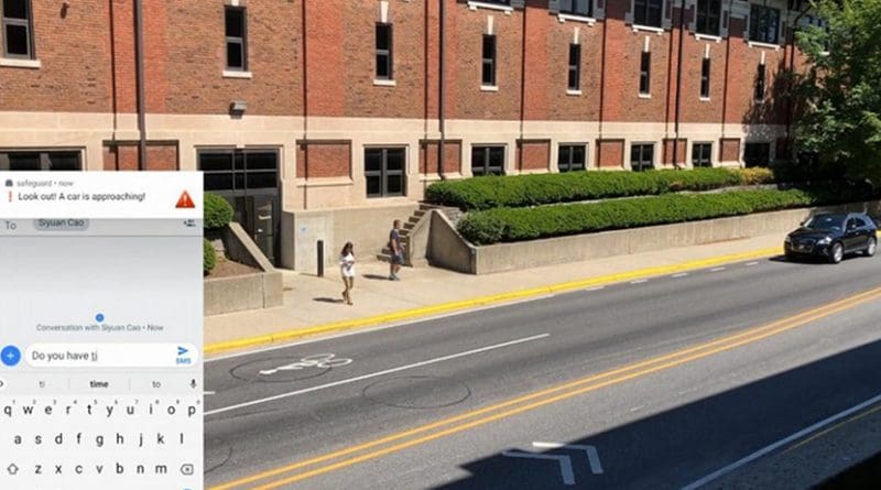 City governments will be able to use the Purdue University public camera technology to send alerts to distracted pedestrians when cars are approaching. Credit He Wang