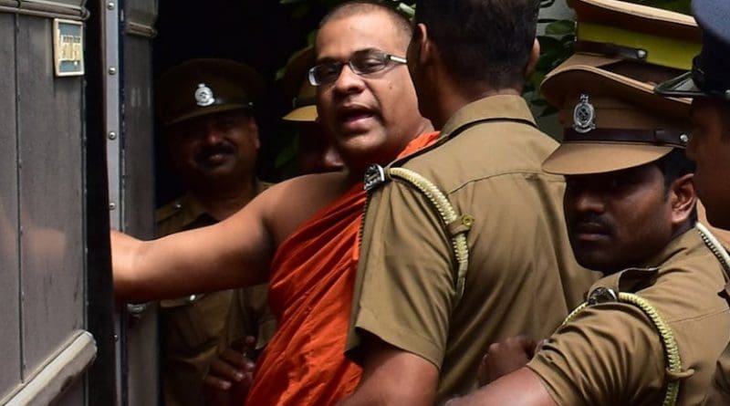Buddhist monk Galaboda Aththe Gnanasara Thera being escorted to a prison bus after his sentencing by Homagama Court on June 14. (Photo by S. Kumar/ucanews.com)