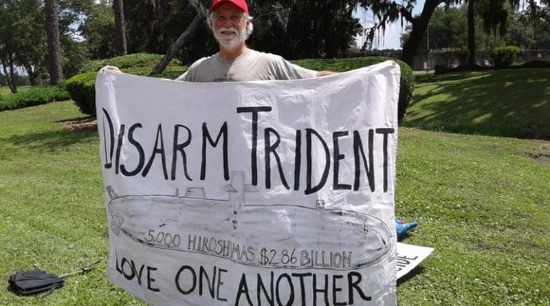 Ken Jones at Nuclear Submarine Base entrance gate, King's Bay, GA Photo credit: Beth Brockman