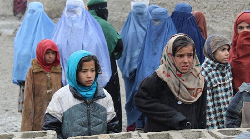 Girls and mothers, waiting for their duvets, in Kabul. Photo Credit: Dr. Hakim