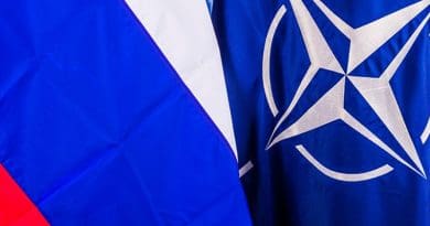 Flags of Russia and NATO. Photo Credit: NATO.