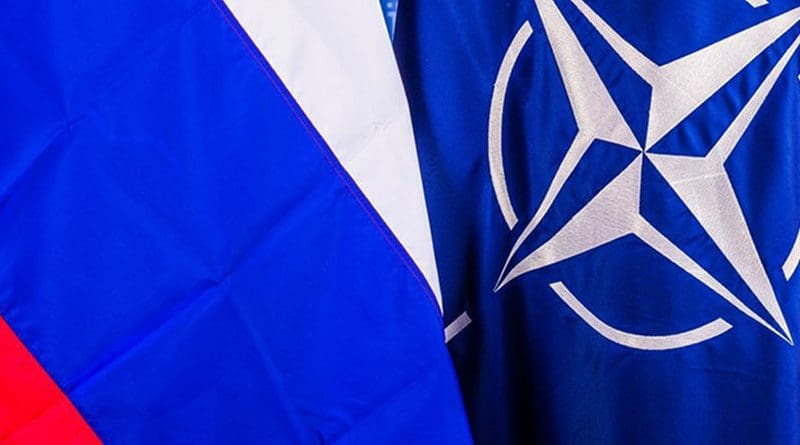 Flags of Russia and NATO. Photo Credit: NATO.