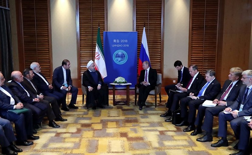 Iranian President Hassan Rouhani and his Russian counterpart Vladimir Putin on the sidelines of the Shanghai Cooperation Organization summit in China’s Qingdao. Photo Credit: Tasnim News Agency.