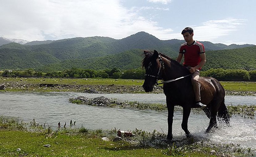 Pankisi Gorge in Georgia, Kist boy with horse. Photo Credit: Sulkhan Bordzikashvili, Wikimedia Commons.