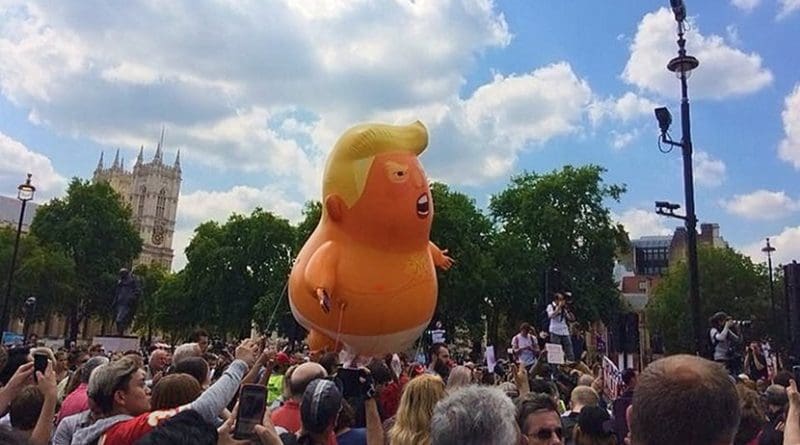 Anti-Trump balloon being flown over Parliament Square in London, United Kingdom. Photo Credit: Wikipedia Commons.