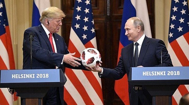 Russia President Vladimir Putin hands US President Donald Trump 2018 World Cup soccer ball. Photo Credit: Kremlin.ru