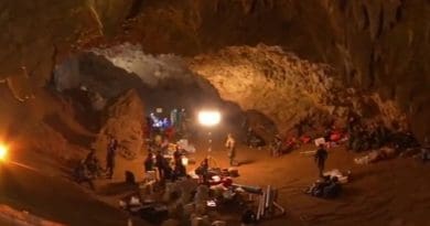 Personnel and equipment in the entrance chamber of Tham Luang (Thailand) cave during rescue operations. Photo Credit: NBT, YouTube, Wikimedia Commons.