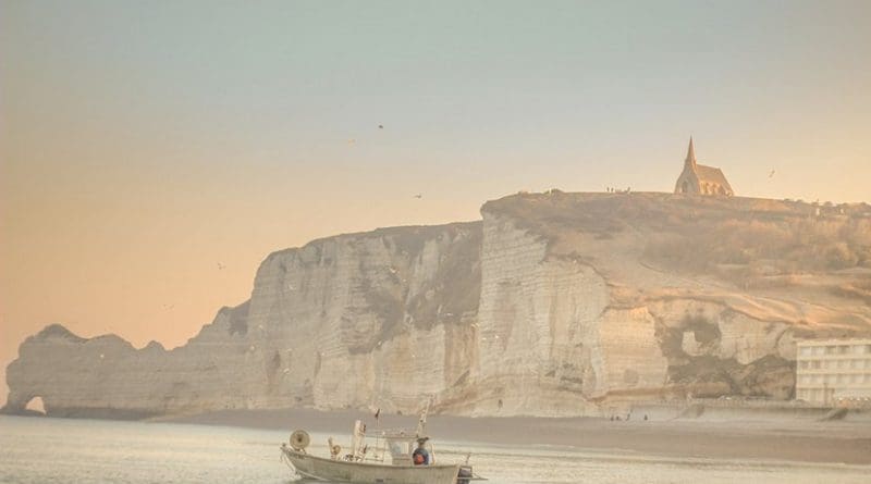 Fishing boat off Dover Cliffs, England.
