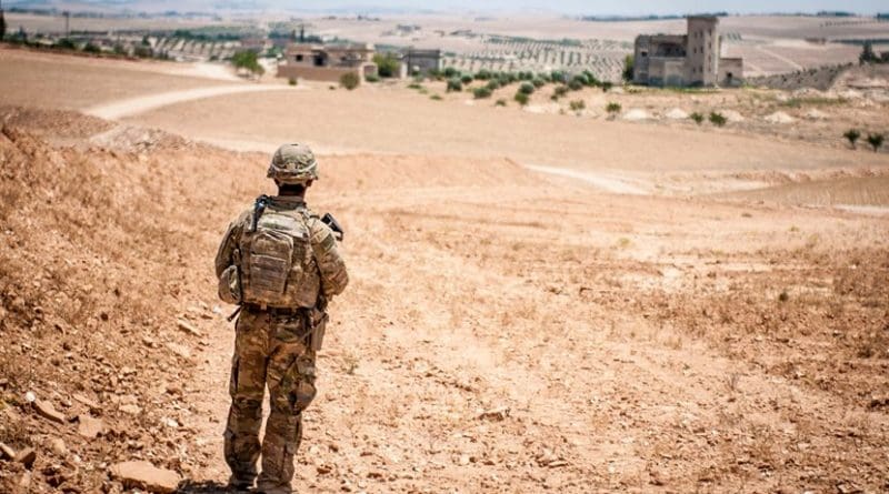File photo of a U.S. soldier providing security during a coordinated, independent patrol along the demarcation line near a village outside Manbij, Syria. U.S. Army photo by Staff Sgt. Timothy R. Koster