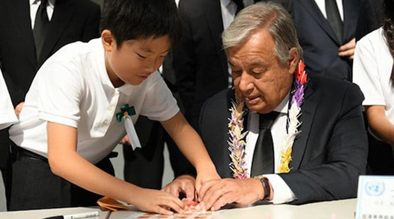 Secretary-General António Guterres folds origami cranes with young Japanese leaders at the Nagasaki Peace Memorial. Credit: Dan Powell | UN Photo.
