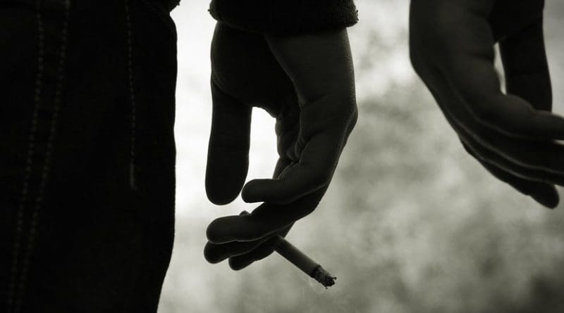 teen smoking cigarette