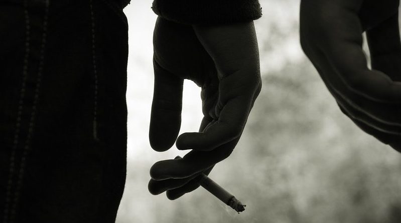 teen smoking cigarette