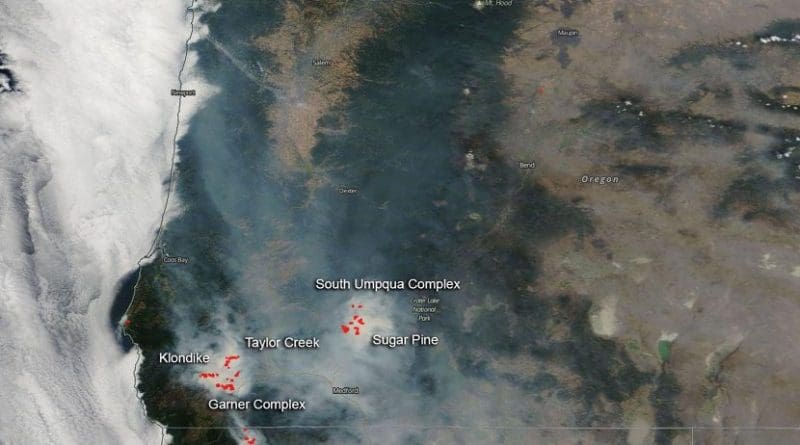 NASA's Aqua satellite captured the image of the fires and smoke blowing from them on August 06, 2018 with the Moderate Resolution Imaging Spectroradiometer, MODIS, instrument. Actively burning areas (hot spots), detected by MODIS's thermal bands, are outlined in red. Each hot spot is an area where the thermal detectors on the MODIS instrument recognized temperatures higher than background. When accompanied by plumes of smoke, as in this image, such hot spots are diagnostic for fire. NASA image courtesy of the NASA/Goddard Space Flight Center Earth Science Data and Information System (ESDIS) project. Caption by Lynn Jenner with information from Inciweb. Credit NASA image courtesy of the NASA/Goddard Space Flight Center Earth Science Data and Information System (ESDIS) project.