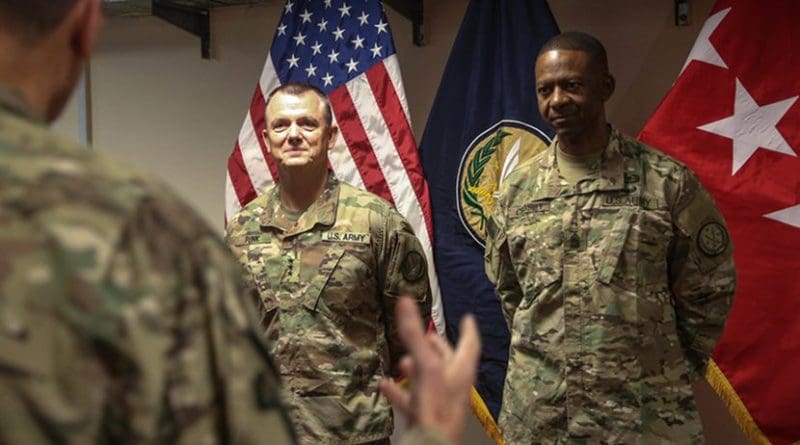 Army Lt. Gen. Paul E. Funk II, outgoing commanding general of Combined Joint Task Force Operation Inherent Resolve, left, and Army Command Sgt. Maj. Michael A. Crosby Jr., stand together while Army Gen. Joseph L. Votel, commander of U.S. Central Command, gives a speech as part of a military decorations ceremony in Baghdad, Sept. 13, 2018. Also at that ceremony, Army Lt. Gen. Paul J. LaCamera, commanding general of the XVIII Airborne Corps, assumed command of the CJTF-OIR from Funk, who is the III Armored Corps commanding general. The III Armored Corps, which deployed from Fort Hood, Texas, to areas in Southwest Asia, transferred its command authority to the XVIII Airborne Corps, deployed from Fort Bragg, North Carolina. CJTF-OIR is a 79-member global coalition that’s dedicated to the defeat of the Islamic State of Iraq and Syria. Army photo by Sgt. 1st Class Mikki L. Sprenkle