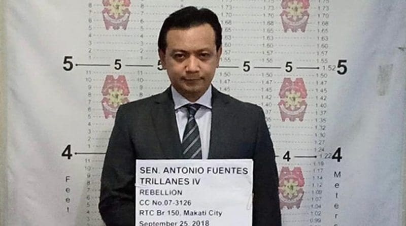 This handout photo shows Philippine Sen. Antonio Trillanes being booked at a police station in Manila following his arrest, Sept. 25, 2018.
