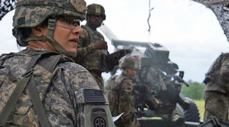 Army Capt. Nargis Kabiri, commander of Alpha Battery, 1st Battalion, 9th Field Artillery Regiment, 3rd Infantry Division Artillery, helps her team prepare an M119 Howitzer on Fort Stewart, Ga., Aug. 22, 2017. Army photo by Pfc. Zoe Garbarino