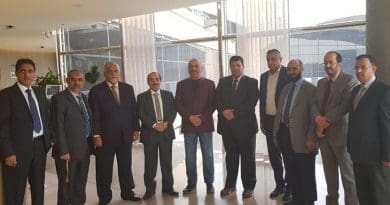 Yemeni Foreign Minister Khaled Al-Yamani (purple jacket) with the government delegation to Geneva. (Supplied)