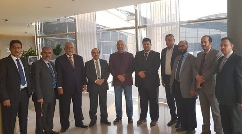 Yemeni Foreign Minister Khaled Al-Yamani (purple jacket) with the government delegation to Geneva. (Supplied)