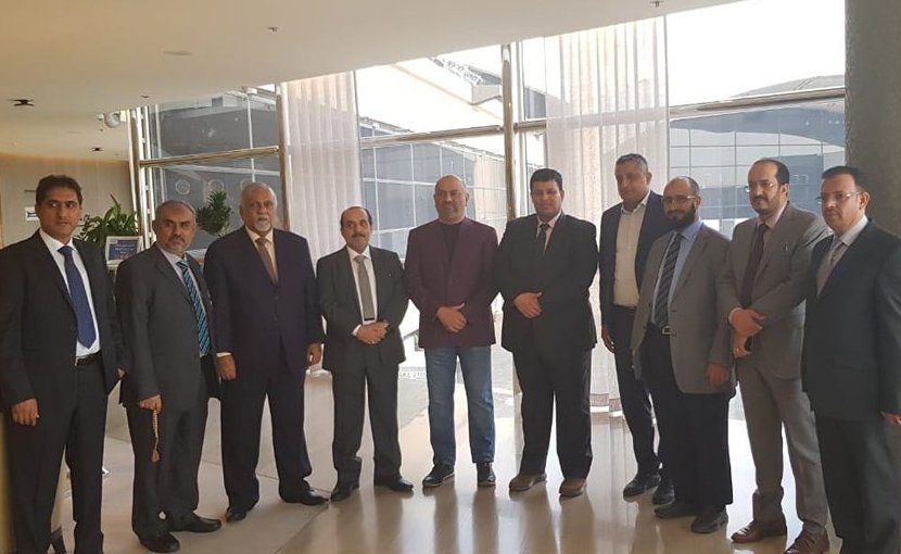 Yemeni Foreign Minister Khaled Al-Yamani (purple jacket) with the government delegation to Geneva. (Supplied)