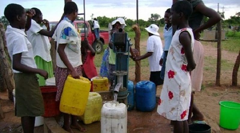 People at a borehole, one of the groundwater sources people have turned to in Zimbabwe's towns and cities as climate change impacts bite. Credit: Construction Review Online.