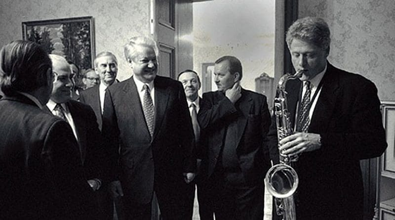 US President Bill Clinton plays the saxophone presented to him by Russian President Boris Yeltsin at a private dinner in Russia. Photo Credit: Bob McNeely, White House, Wikipedia Commons.