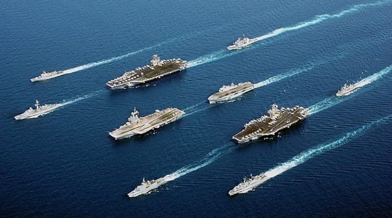 File photo of USS John C. Stennis (top left) in a 5-country multinational fleet, during Operation Enduring Freedom in the Oman Sea. Photo Credit: US Navy