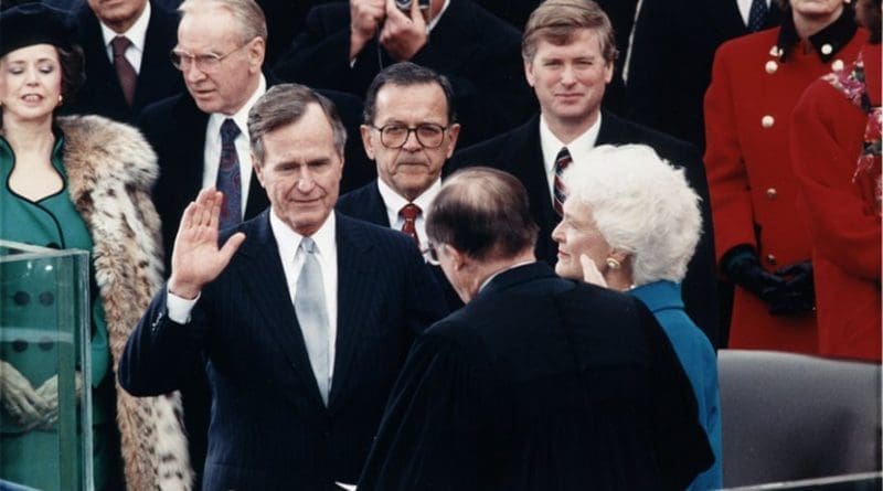 Chief Justice William Rehnquist administering the oath of office to President George H. W. Bush during Inaugural ceremonies at the United States Capitol. January 20, 1989. Photo Credit: Wikimedia Commons.