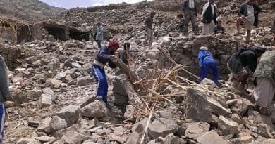 Villagers scour rubble for belongings scattered during the bombing of Hajar Aukaish, Yemen, in April 2015. (A. Mojalli/VOA)
