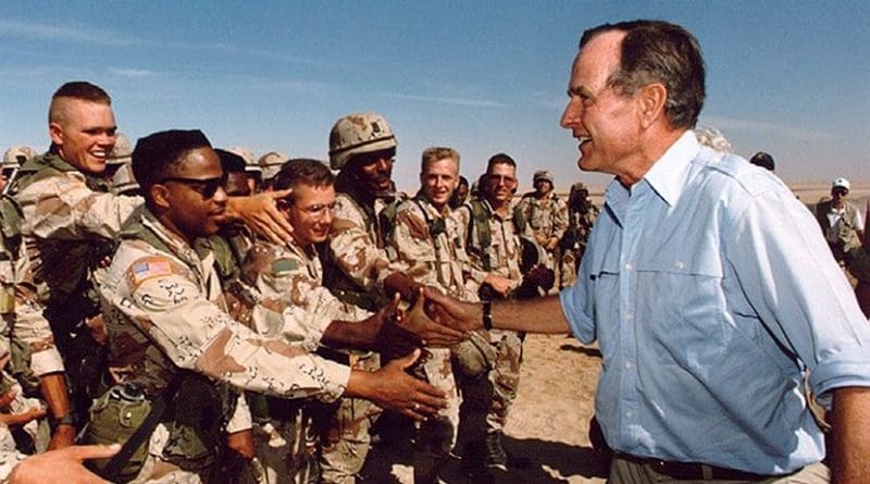 President George H.W. Bush talks with the troops in Saudi Arabia. Photo Credit: White House, Wikimedia Commons.