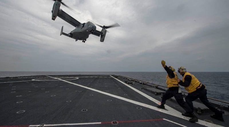 Sailors signal to MV-22 Osprey during flight quarters aboard USS Ashland, East China Sea, March 10, 2017 (U.S. Navy/Kaleb R. Staples)