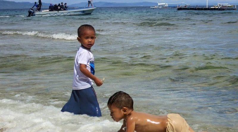 Philippines children playing beach