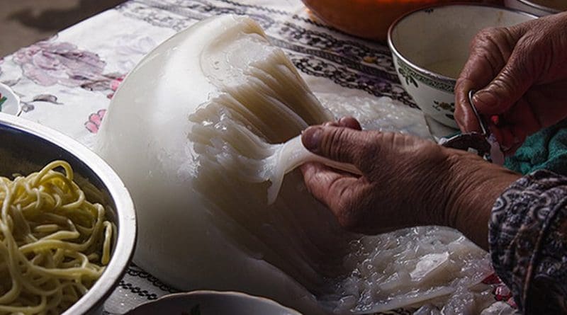 A woman in Kyrgyzstan making soup. Photo by RockMyBike, Flickr