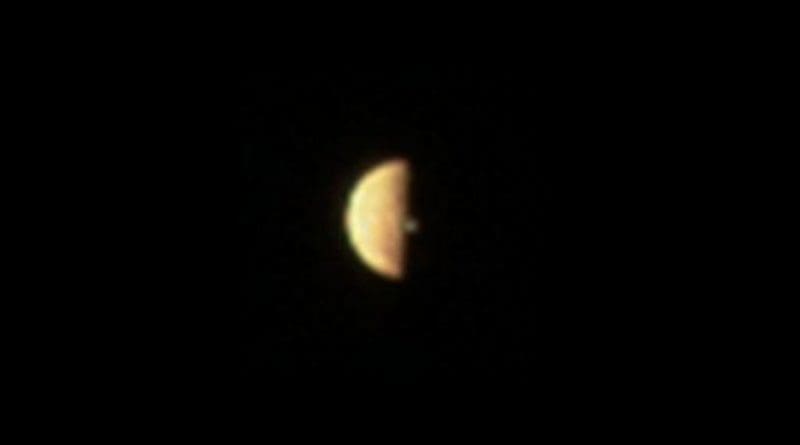 JunoCam acquired three images of Io prior to when it entered eclipse, all showing a volcanic plume illuminated beyond the terminator. The image shown here, reconstructed from red, blue and green filter images, was acquired at 12:20 (UTC) on Dec. 21, 2018. The Juno spacecraft was approximately 300,000 km from Io. Credit NASA/SwRI/MSSS