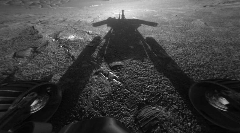 The dramatic image of NASA's Mars Exploration Rover Opportunity's shadow was taken on sol 180 (July 26, 2004) by the rover's front hazard-avoidance camera as the rover moved farther into Endurance Crater in the Meridiani Planum region of Mars. Credits: NASA/JPL-Caltech