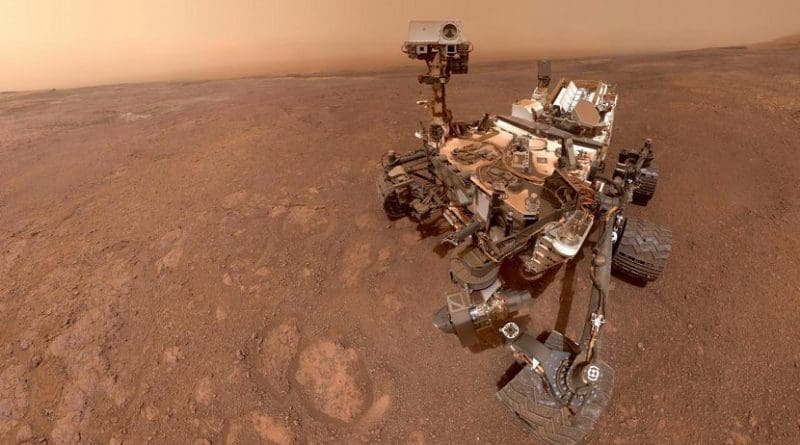 In a selfie taken in mid-January 2019, Mars rover Curiosity prepares to enter a new, clay-mineral-rich unit on its traverse up Mount Sharp in Gale Crater. Mission scientists are anxious to see what a new gravity-measuring technique will reveal about the mountain and Gale Crater's history. Credit NASA/JPL-Caltech/MSSS
