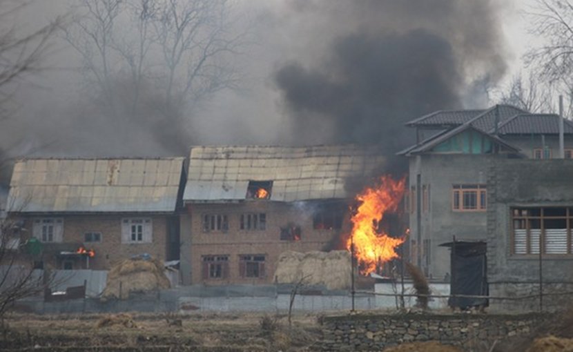 A house burns after security forces set it on fire in Kashmir’s Pulwama district to force suspected militants out, Feb 18, 2019. Photo Credit: Sheikh Mashooq/ BenarNews