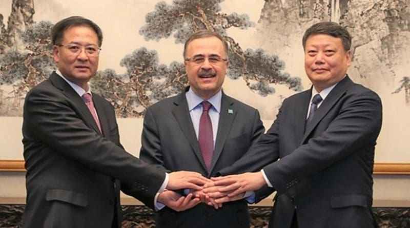 Amin Nasser, center, the president and chief executive of Saudi Aramco, Jiao Kaihe, left, the chairman of NORINCO Group, Tang Yijun, the governor of Liaoning Province, during the signing ceremonies in Beijing, China. (Aramco)