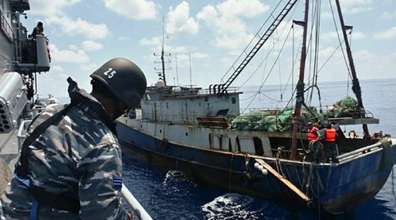 File photo of Indonesian troops capturing a Chinese fishing boat in the Natuna Sea. Photo Credit: Indonesian Navy