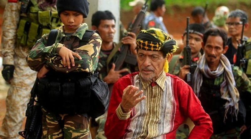 Moro National Liberation Front leader Nur Misuari (center) speaks to reporters while under heavy security in his mountainous base on the southern Philippine island of Jolo, May 29, 2016. Mark Navales/BenarNews