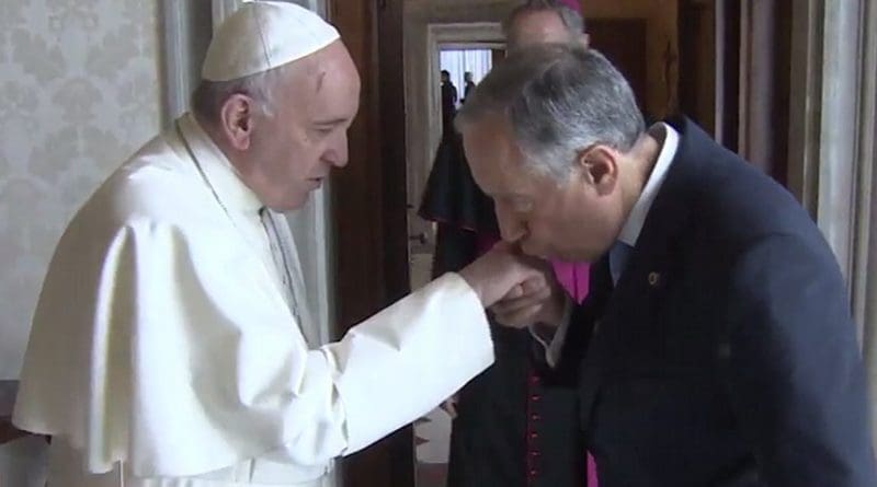 The President of Portugal, Marcelo Rebelo de Sousa, kissing the ring of Pope Francis during a state visit to the Vatican. Photo Credit: Centro Televisivo Vaticano, Wikimedia Commons.