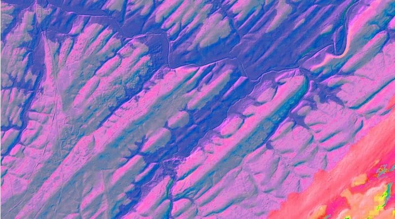 Digital elevation map of sediment strata formed on a lake bottom some 220 million years ago, near present day Flemington, N.J. The lakebed was later tilted so that its cross section now faces the sky. Purple sections are ridges -- remains of hard, compressed sediments formed when climate was wet and the lake deep; alternating greenish sections are lower areas made of eroded-out softer sediments from dryer times. Each pair represents 405,000 years. Groups of ridges in lower part of image manifest a separate 1.7 million-year cycle that has today grown to 2.4 million years. Thee 40-square-mile area is dissected by parts of the modern Raritan and Neshanic rivers (blue). Credit LIDAR image, US Geological Survey; digital colorization by Paul Olsen