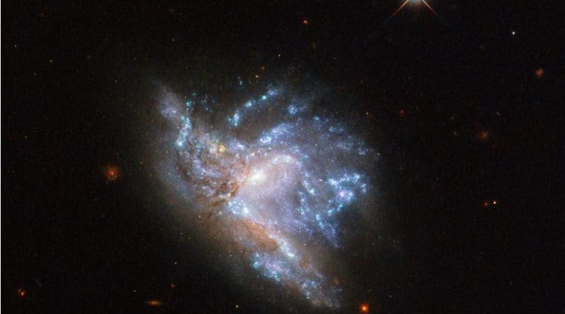 Located in the constellation of Hercules, about 230 million light-years away, NGC 6052 is a pair of colliding galaxies. Credit ESA/Hubble & NASA, A. Adamo et al.