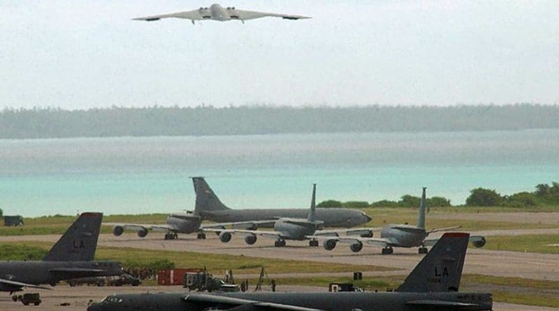 A B-2 bomber takes off, with B-52 bombers on tarmac on Diego Garcia. Photo Credit: U.S. Air Force photo by Senior Airman Nathan G. Bevier
