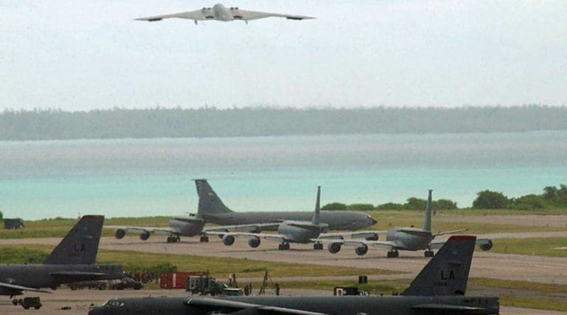 A B-2 bomber takes off, with B-52 bombers on tarmac on Diego Garcia. Photo Credit: U.S. Air Force photo by Senior Airman Nathan G. Bevier