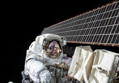 This is Scott Kelly at work on ISS maintenance with the station's solar arrays visible in the background. Credit NASA