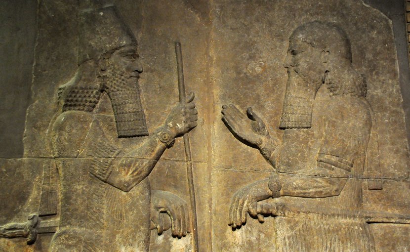 Sargon II (left) faces a high-ranking official, possibly Sennacherib his son and crown prince. 710–705 BC. From Khorsabad, Iraq. The British Museum, London. Wikipedia Commons