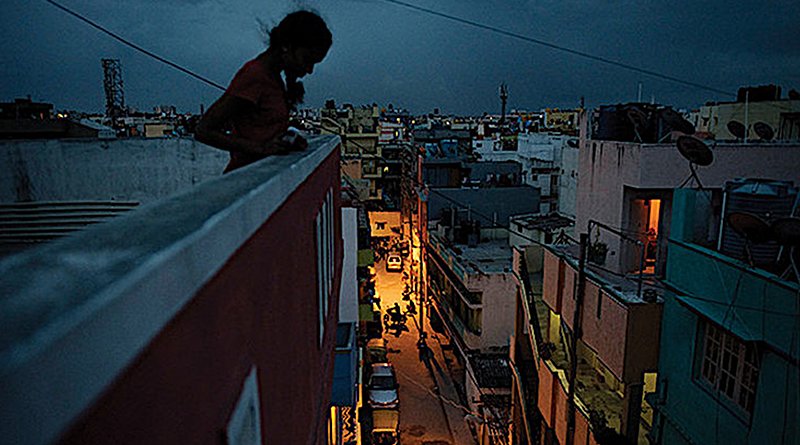 Girl on roof of a factory in India. Source: UNFPA © Andrea Bruce/Noor