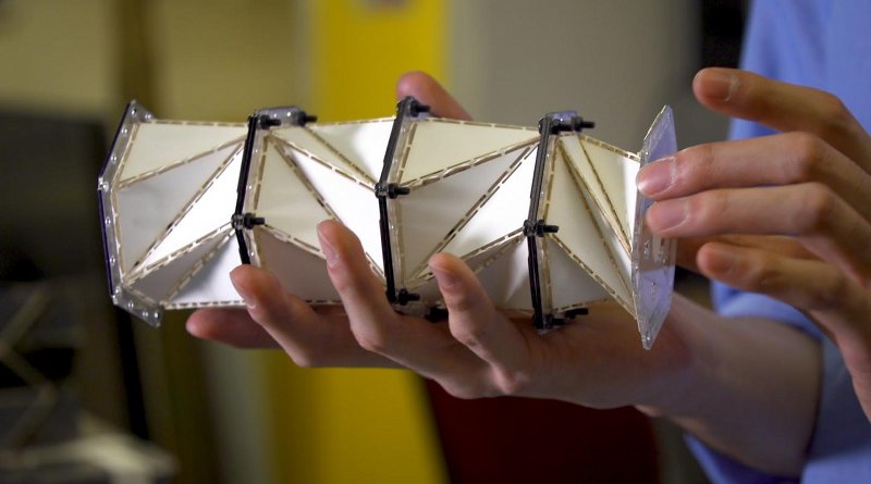 nspired by the paper folding art of origami, a University of Washington team created a paper model of a metamaterial that uses 'folding creases' to soften impact forces and instead promote forces that relax stresses in the chain. Credit Kiyomi Taguchi/University of Washington