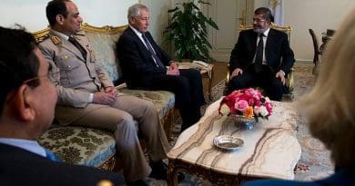 Egypt's then President Mohamed Morsi (right) and General al-Sisi (left) listen to visiting U.S. Secretary of Defense Chuck Hagel in 2013. Photo Credit: US Secretary of Defense